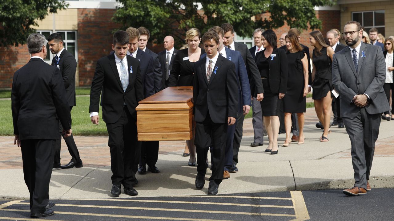 Pallbearers carry Otto Warmbier's casket from Wyoming High School on Thursday.