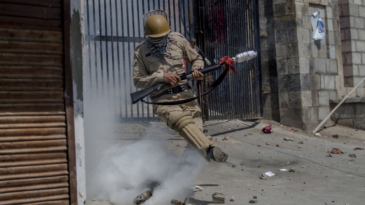 A police officer kicks a tear-gas shell during clashes with Kashmiri protesters in Srinagar, India, on Friday, June 16. <a href="http://www.cnn.com/2016/09/30/asia/kashmir-explainer/" target="_blank">Read more: The Kashmir dispute explained</a>