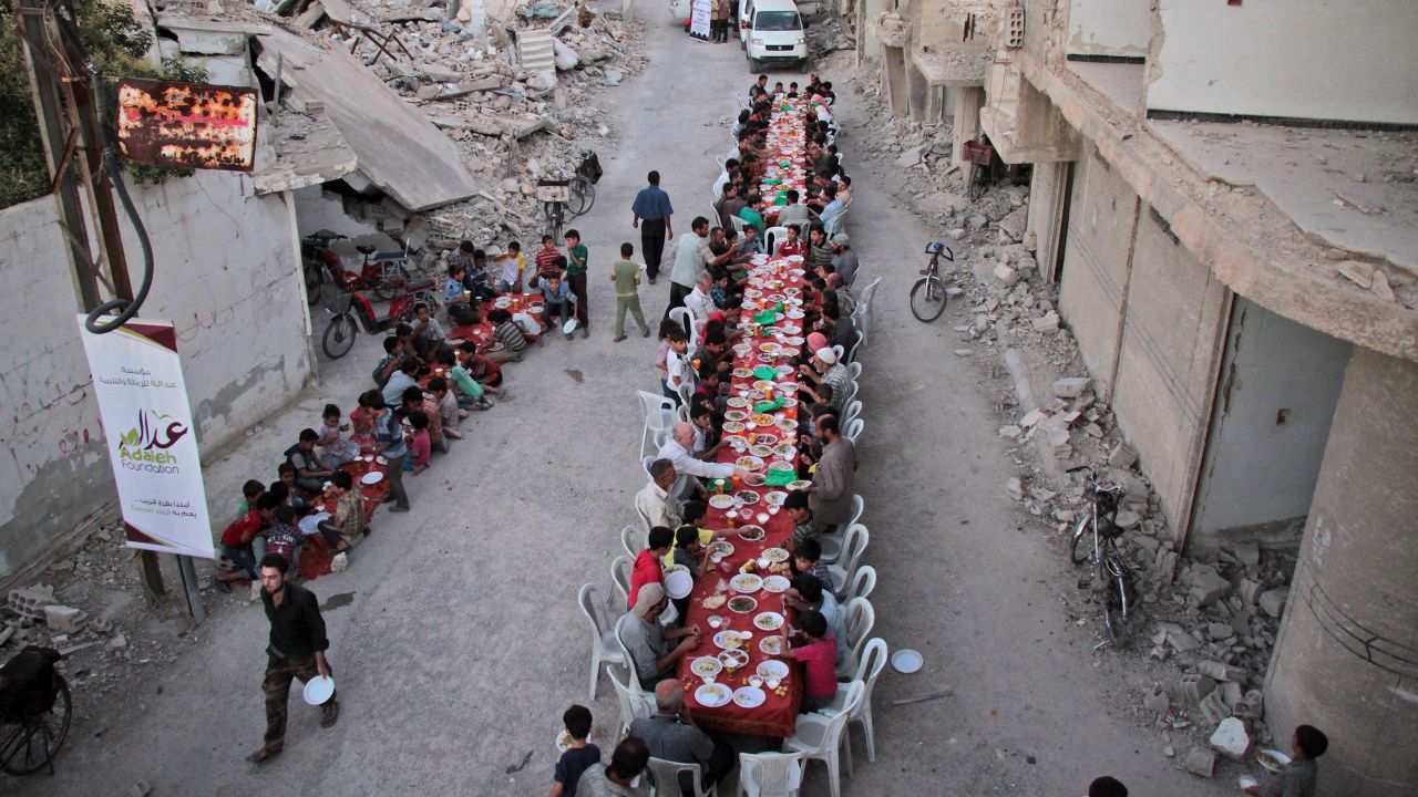 Residents of the war-torn city of Douma, Syria, break their Ramadan fast on Sunday, June 18. Ramadan, the most sacred month in the Muslim year, ends on June 24.