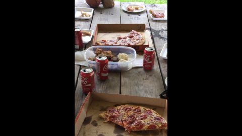The sheriff's department had a free lunch in the park with the deputy's family to reward the inmates. 