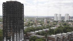The burnt Grenfell Tower apartment building stands testament to the recent fire in London, Friday, June 23, 2017.  British officials have ordered an immediate examination Friday, into a fridge-freezer that is deemed to have started the fire in the 24-storey high-rise apartment building early morning of June 14th, and the outside cladding of the building which is thought to have helped spread the fire, according to police, leaving dozens dead.(AP Photo/Frank Augstein)