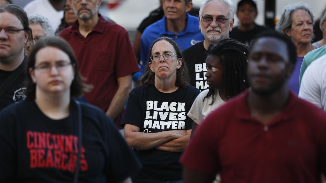 Protesters, including some wearing Black Lives Matter shirts, gather outside the Hamilton County Courthouse during a demonstration. 