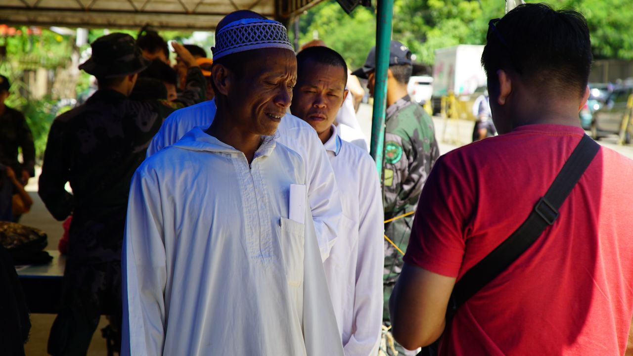 Civilians entering the city of Iligan in the southern Philippines island of Mindanao have their documents checked by police and military personnel on June 21, 2017.