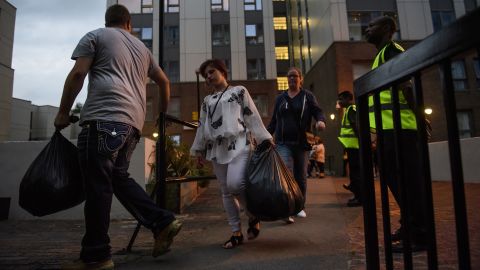 Residents are evacuated Friday from the Taplow block of the Chalcots Estate in Camden.