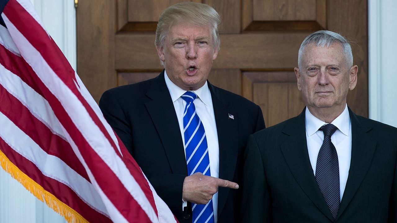 Donald Trump welcomes retired United States Marine Corps general James Mattis as they pose for a photo before their meeting at Trump International Golf Club, November 19, 2016 in Bedminster Township, New Jersey. 