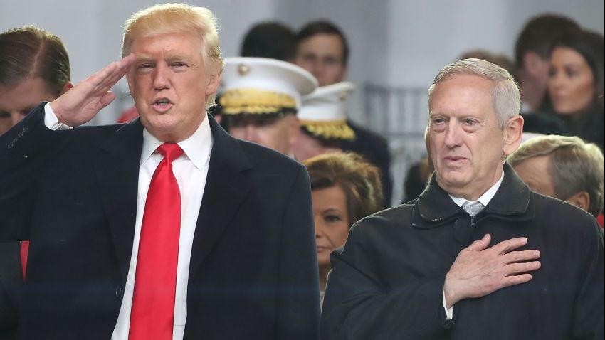 President Donald Trump stands with with Secretary of Defense nominee Gen. James Mattis Ret. as a parade passes the inaugural parade reviewing stand in front of the White House on January 20, 2017 in Washington, DC.