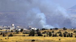 A picture taken from the Israeli-occupied Golan Heights shows smoke billowing from the Syrian side of the border on June 24, 2017.