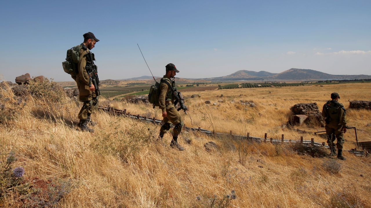 Israeli soldiers patrol near the border with Syria after projectiles fired from the war-torn country hit the Israeli occupied Golan Heights on June 24, 2017. An Israeli aircraft carried out a strike on Syria after 10 projectiles hit the occupied Golan Heights, an army spokesman said. The Israeli Air Force also targeted two tanks of the "Syrian regime" in the northern part of the Golan, the spokesman said, adding the projectiles did not cause any casualties.