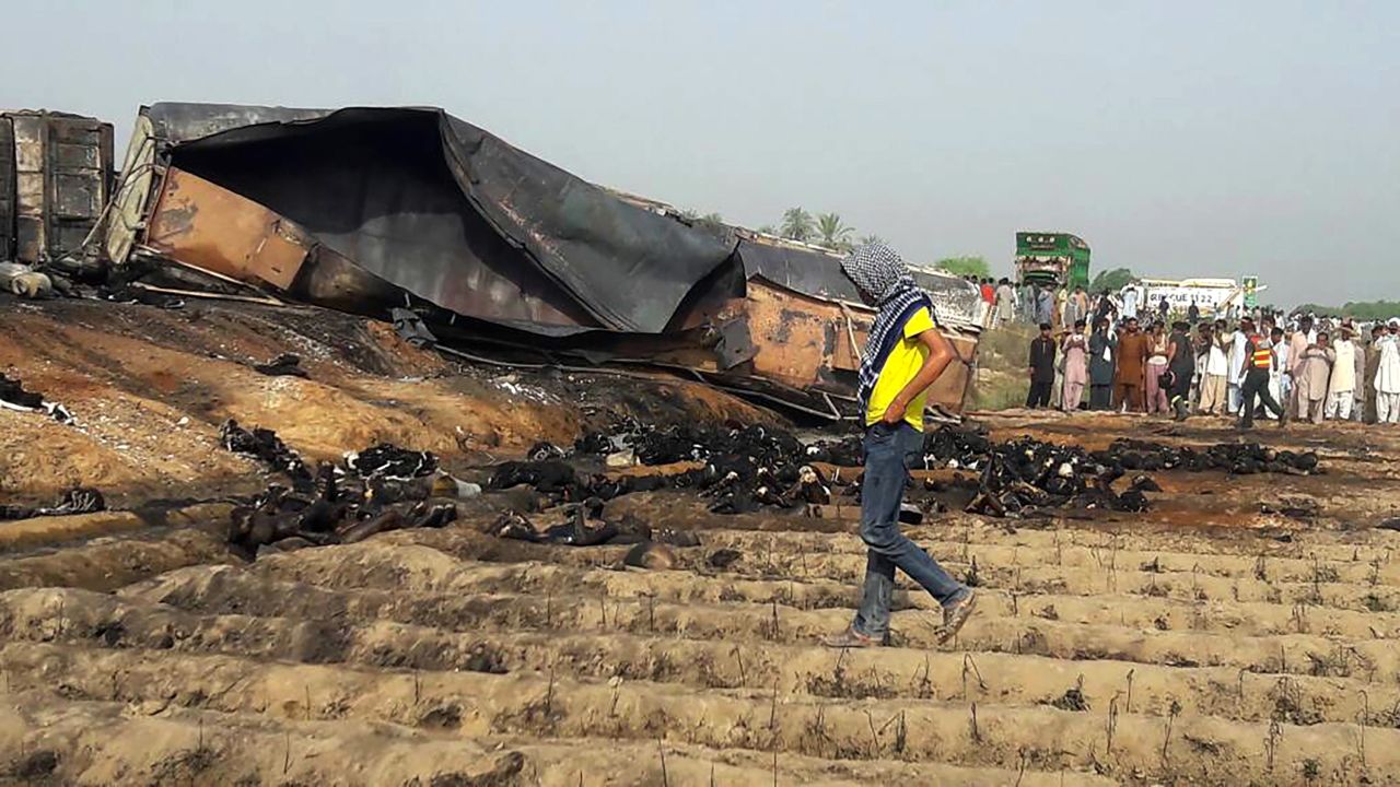 Burned bodies are strewn around the wreckage of the tanker.