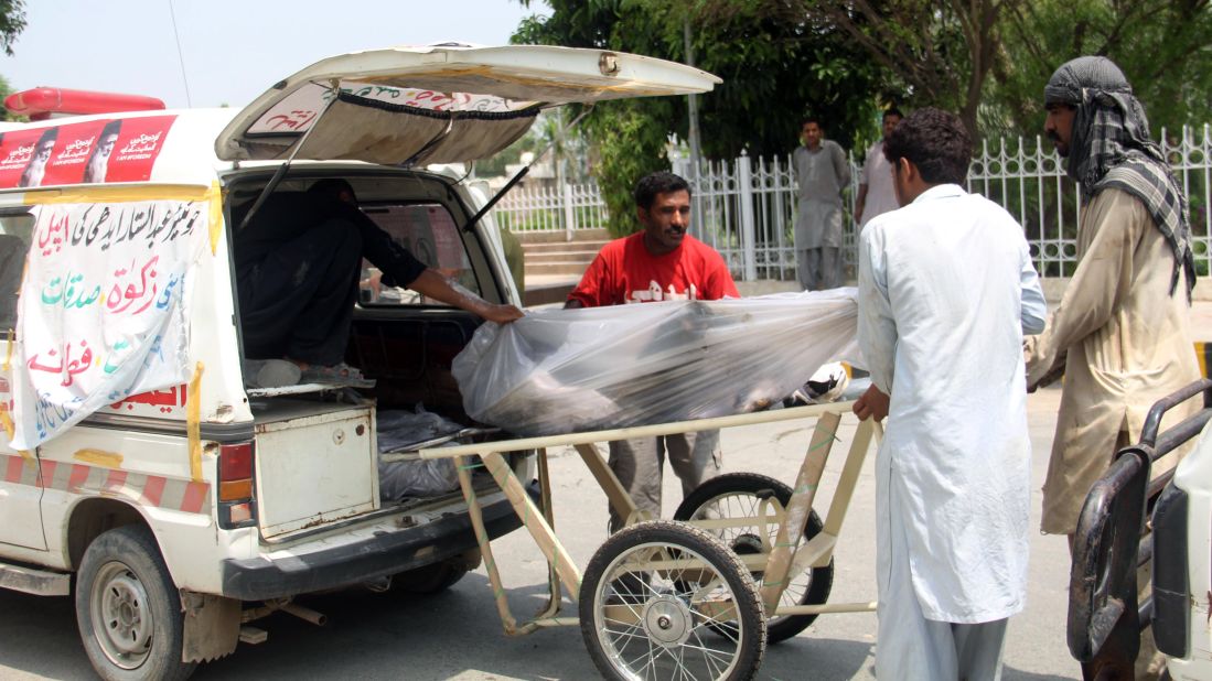 Victims are loaded onto a stretcher outside a hospital in Bahawalpur, Pakistan.