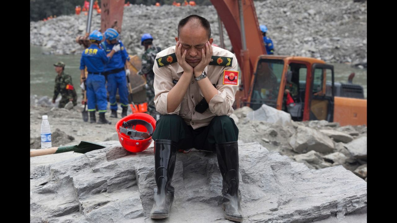 A rescue worker takes a nap on June 25.
