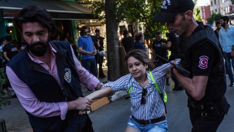 ISTANBUL, TURKEY - JUNE 25: A woman is arrested by police after gathering to support the LGBT Pride March on June 25, 2017 in Istanbul, Turkey. The 2017 LGBT Pride March was banned by authorities for the third year. Organisers defied the order and people attempted to march to Taksim Square but were met by a heavy police presence and the crowd was dispersed by tear gas and several people were arrested. (Photo by Chris McGrath/Getty Images)