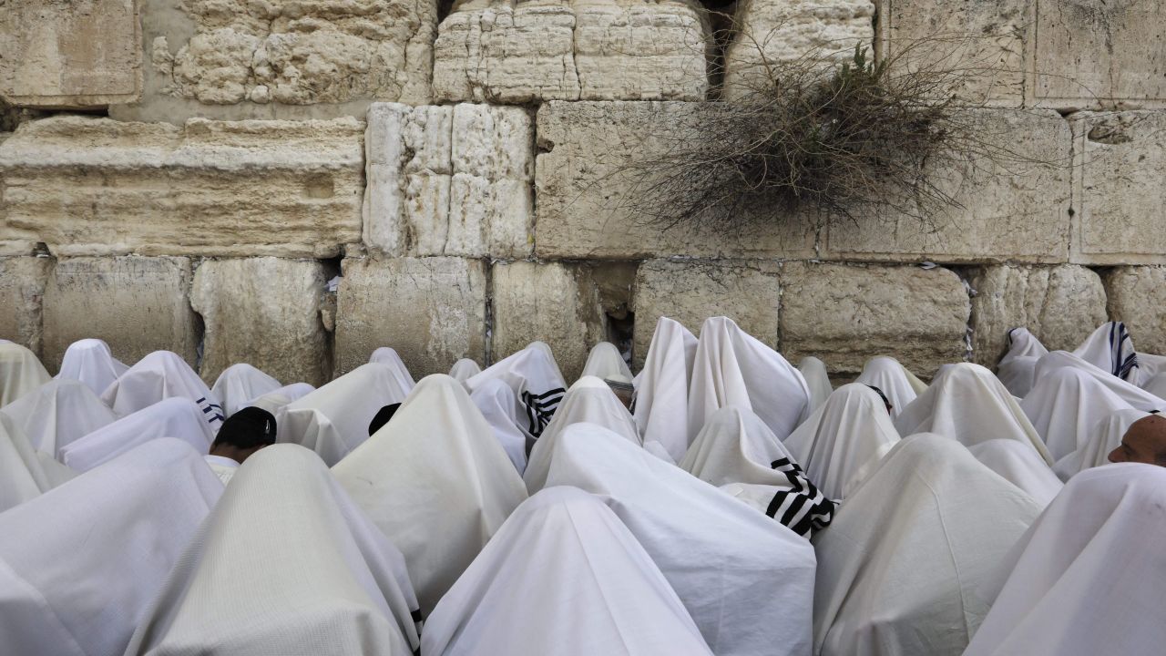 Jewish people wearing prayer shawls take part in the Cohanim prayer (priest's blessing)