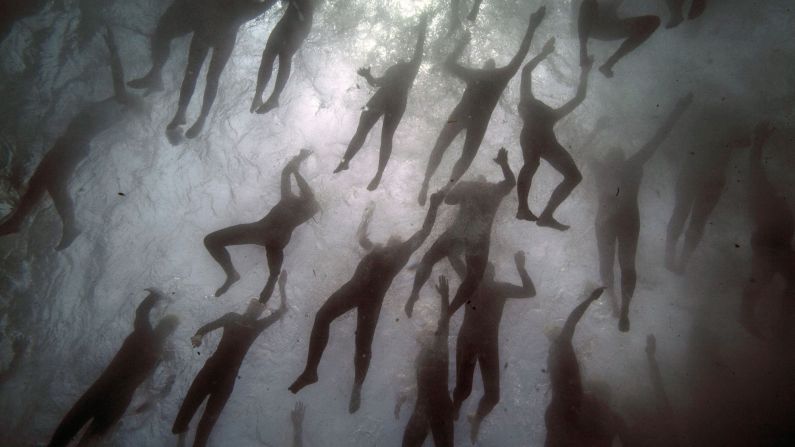 Swimmers begin the Monte-Cristo Challenge, a swimming event off the coast of Marseille, France, on Friday, June 23. 