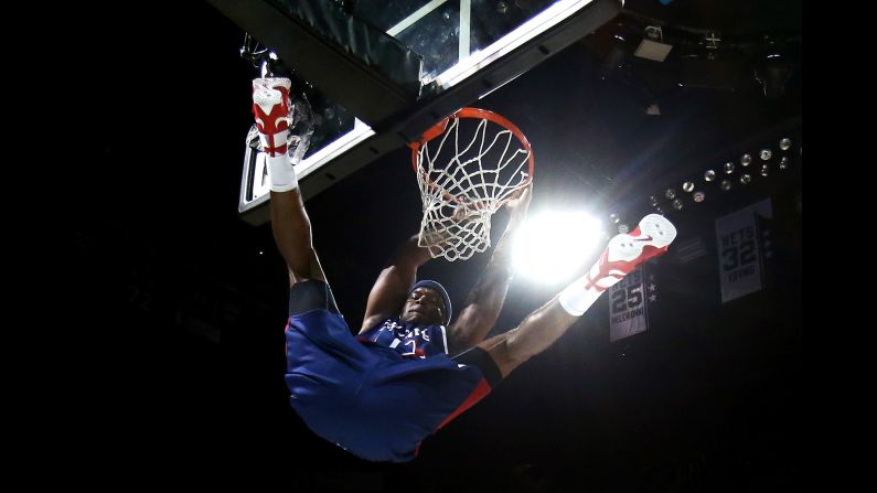 Former NBA star Jermaine O'Neal throws down a dunk during a Big 3 basketball game in New York on Sunday, June 25. The three-on-three basketball league, featuring many former NBA stars, made its debut last week.