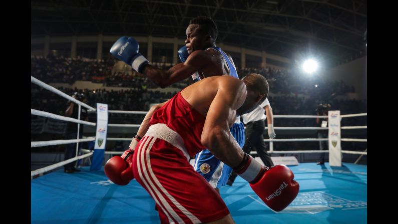 Congo's Mulumba Mbaya, in blue, boxes Egypt's Eslam Ahmed Aly Mohamed during the African Championships on Saturday, June 24.