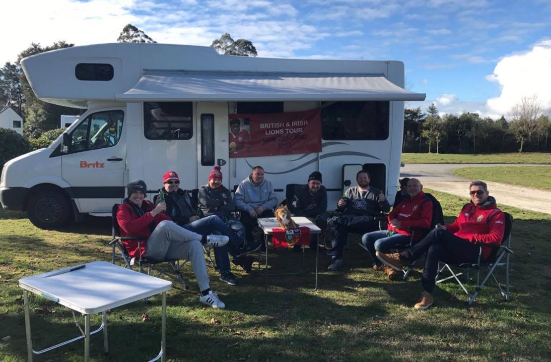 Alex Edwards pictured outside his campervan with fellow Lions fans he has met while in New Zealand