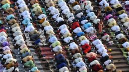 Indian Muslims offer prayers during Eid al-Fitr at the Jama Masjid mosque in New Delhi on June 26, 2017.
