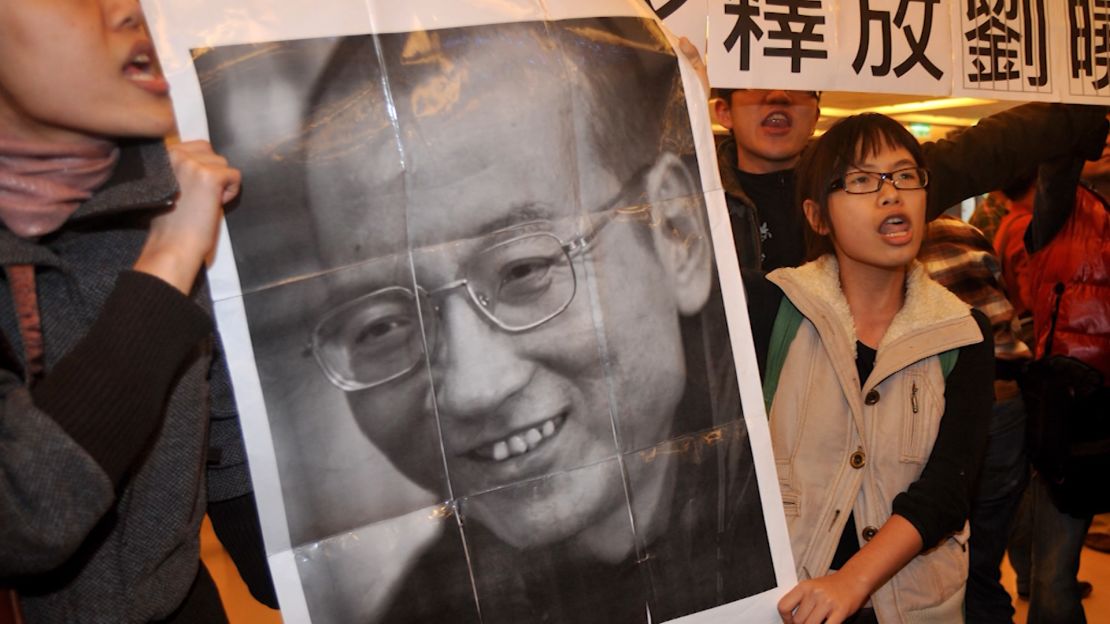 A poster of Liu Xiaobo is held up during a protest in Hong Kong.