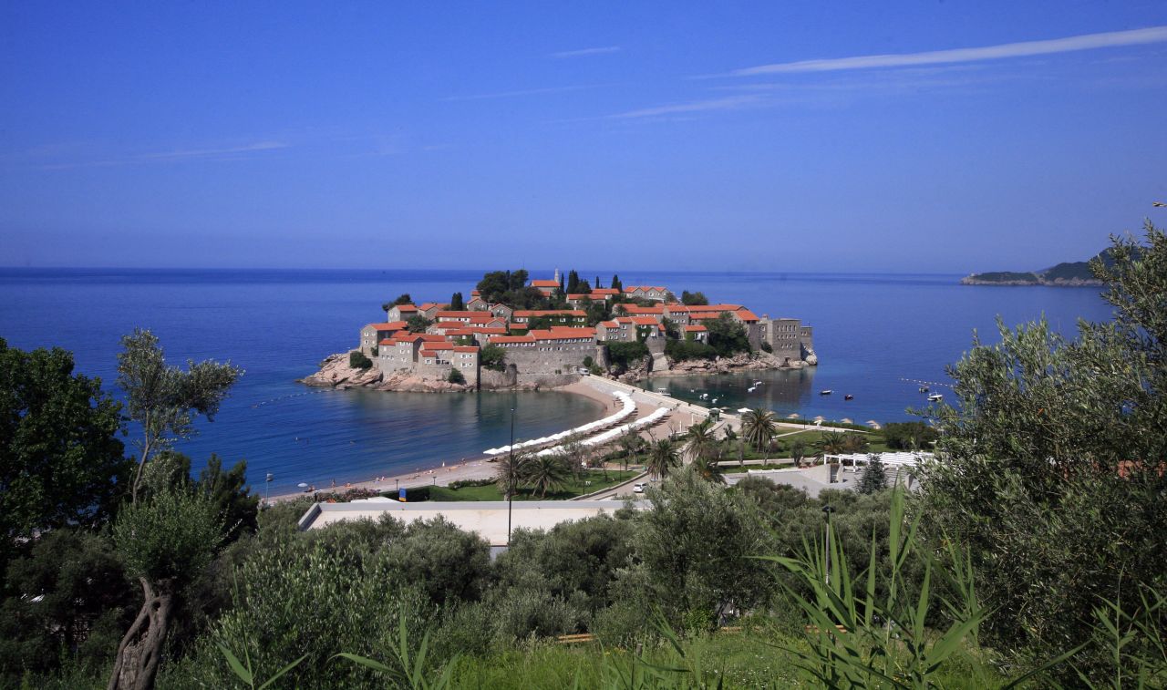 <strong>Sveti Stefan:</strong> Another accommodation option is the luxury five-star hotel-island of Sveti Stefan. The resort's charming villas are secluded and glamorous.