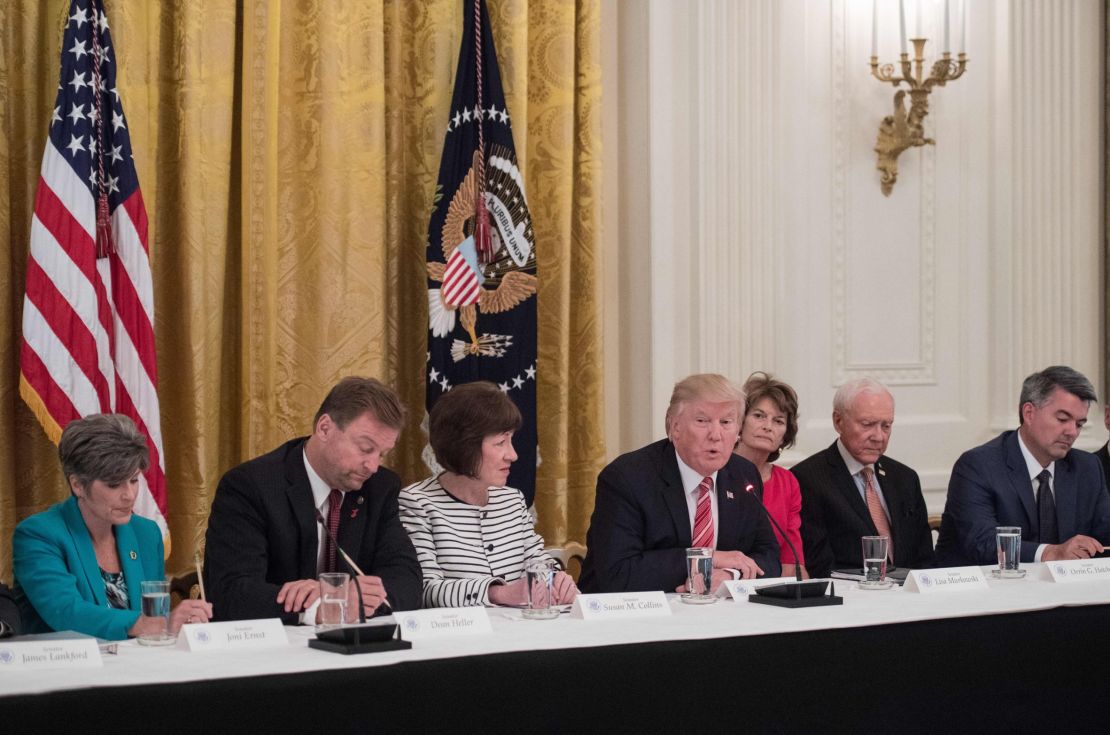 President Trump with, from left, US Sens. Joni Ernst of Iowa, Dean Heller of Nevada, Susan Collins of Maine, Lisa Murkowski of Alaska,  Orrin Hatch of Utah  and Cory Gardner of Colorado as Republican senators meet with Trump to discuss the health care bill.