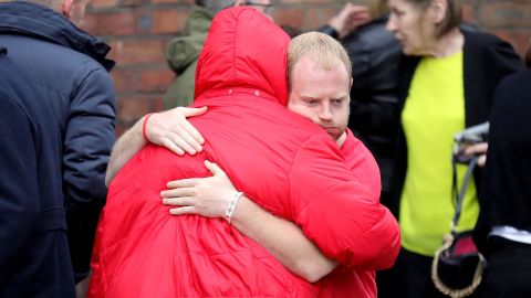 Family members react after the families of the 96 Hillsborough victims were told the decision that the Crown Prosecution Service will proceed with criminal charges.