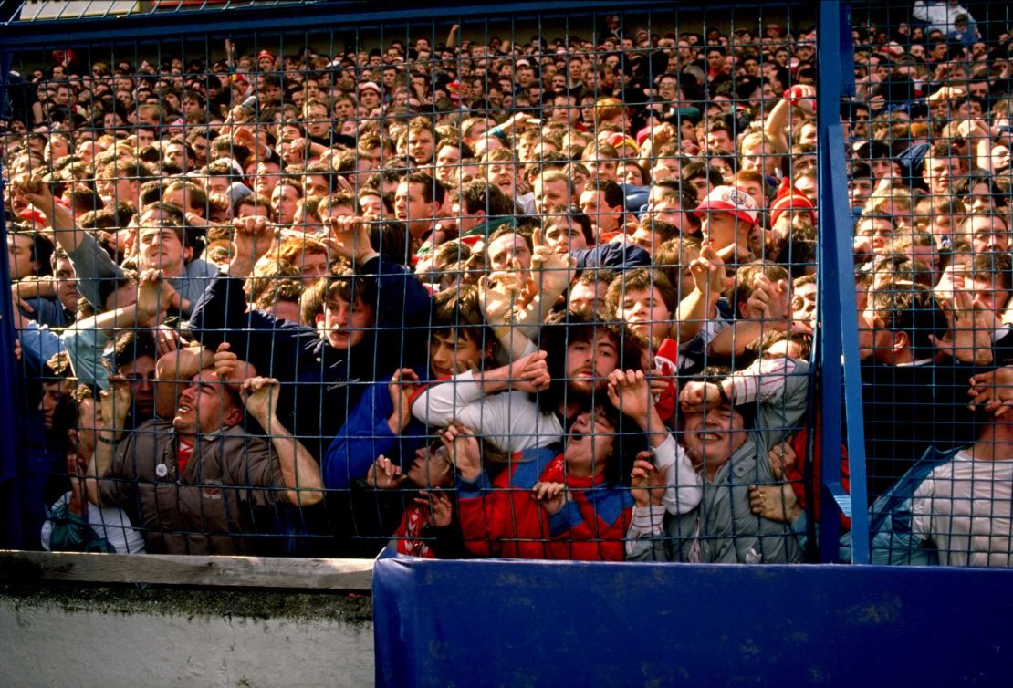 Supporters are crushed against the barrier as disaster strikes before the FA Cup semi-final match.