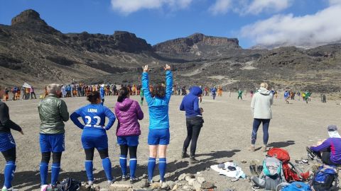 Substitutes' cheer from the sidelines during the match.