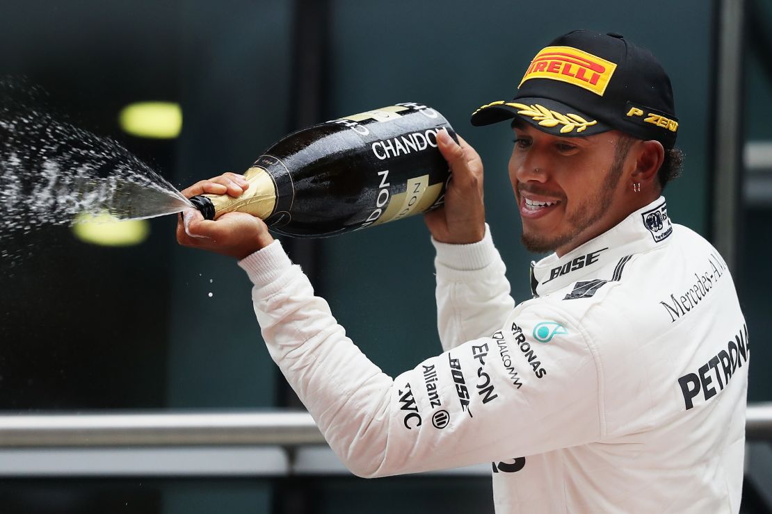 Hamilton celebrates his win in Shanghai this April.
