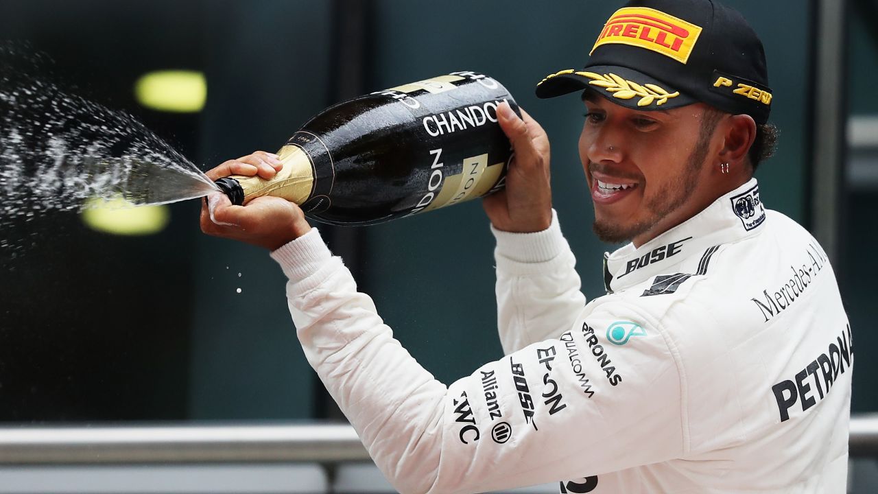 Hamilton celebrates his win in Shanghai this April.