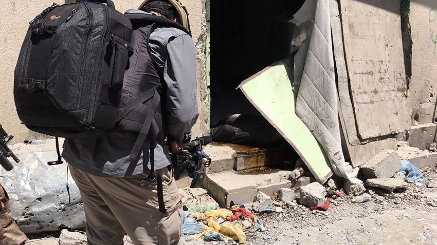 Hands of a dead Isis fighter killed days earlier see  on doorsteps of home in the Old City.