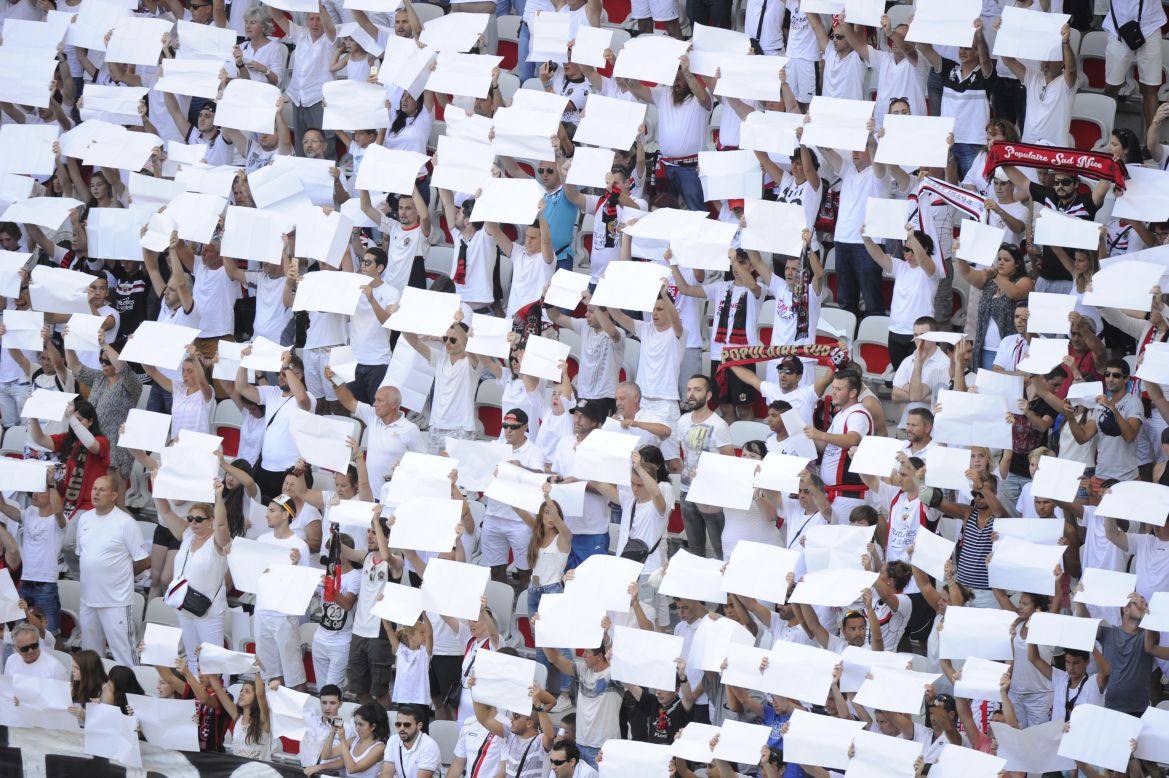 Nice supporters in the grandstand held white placards in tribute to the victims of the Bastille Day attack in Nice on the club's opening day last August. "The club helped a lot after the attacks," says Nice native and club supporter Colombo.