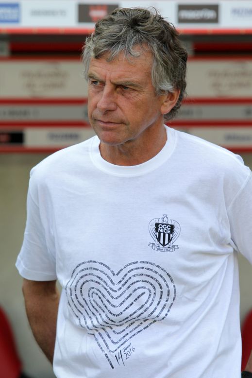 Rennes' coach Christian Gourcuff wears a T-shirt in tribute to the victims of the Bastille Day attack in Nice as he looks on before the French Ligue 1 football match between OGC Nice and Rennes on August 14, 2016, at the Allianz Riviera stadium in Nice.