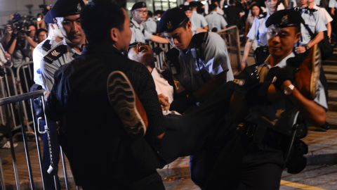 Activist Joshua Wong was arrested Wednesday in Hong Kong's Golden Bauhinia Square ahead of the 20th anniversary of the city's handover to China.