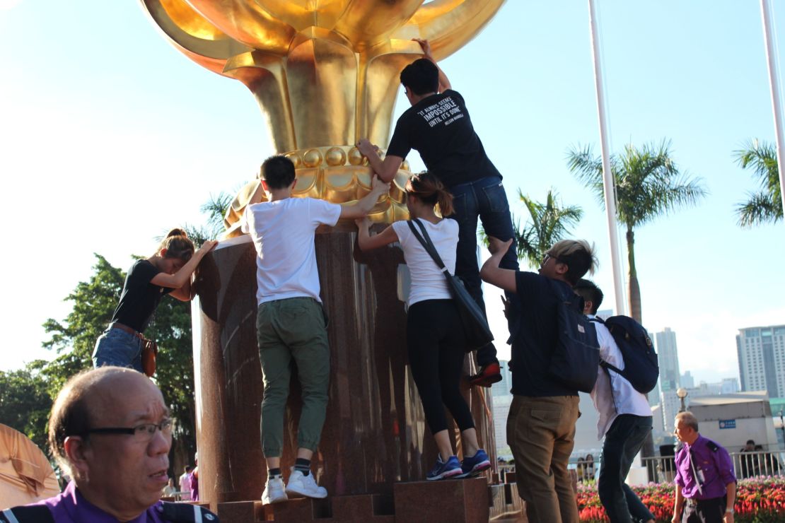 Pro-democracy protesters storm Golden Bauhinia Square in central Hong Kong on Wednesday. 