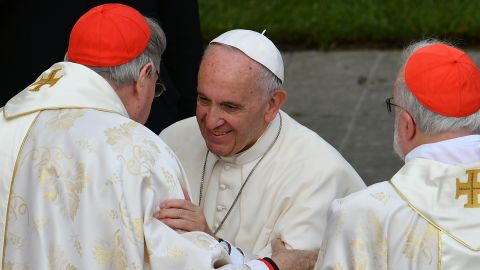 Pope Francis (C) greets cardinal George Pell (L) of Australia after the celebration of a mass marking the end of the Jubilee of Mercy, on November 20, 2016.