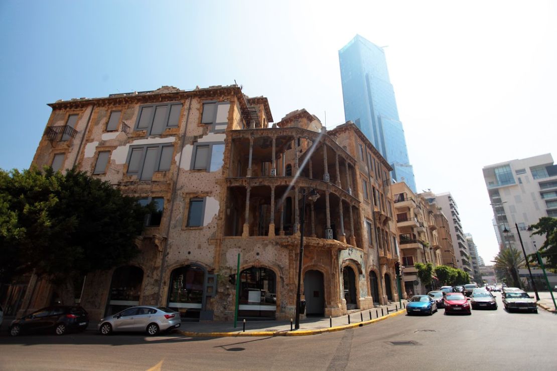 A skyscraper rises up behind Beit Beirut.