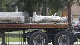 The top section of a Confederate statue called "Johnny Reb" is loaded on a truck before being removed from a downtown park Tuesday, June 20, 2017, in Orlando, Fla. The statue will be relocated to a Confederate section of a nearby cemetery.