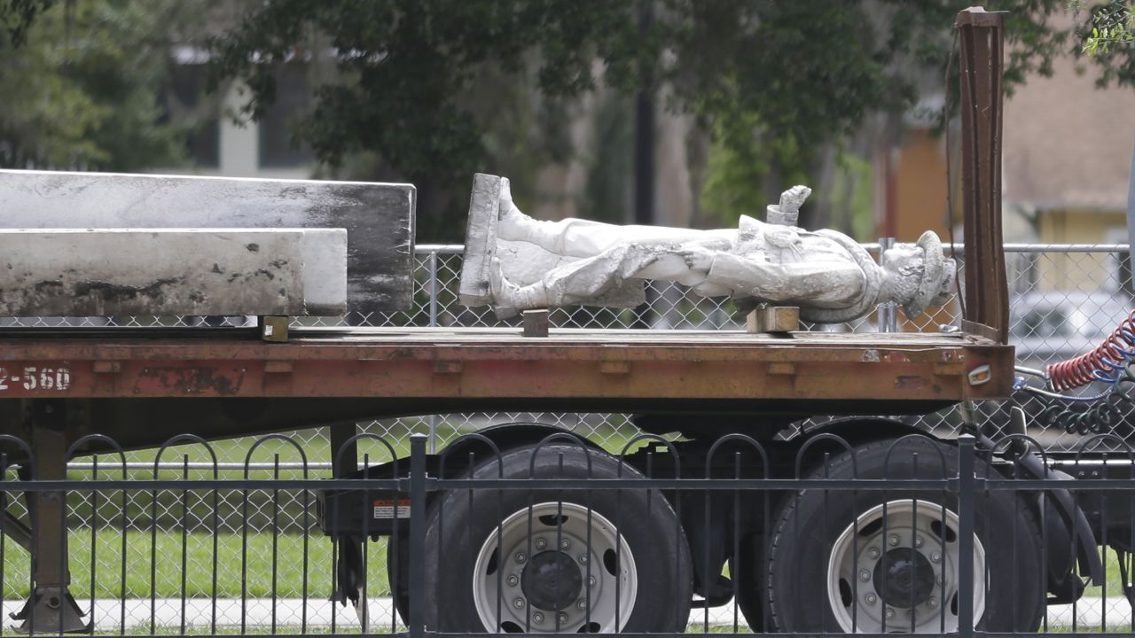 Part of Orlando's "Johnny Reb" statue is removed from Eola Park in June.