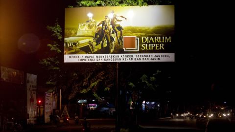 A board advertises a cigarette brand along a road in Yogyakarta, Indonesia, in 2011. 