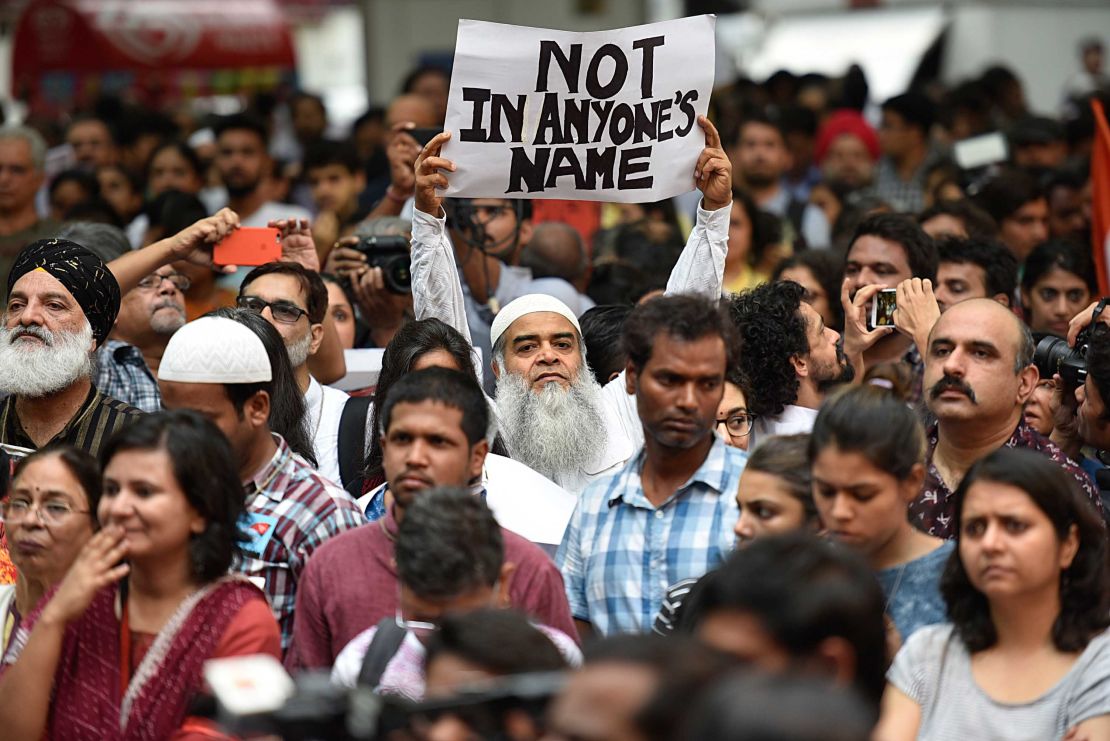 Citizens and celebrities hold signs at the New Delhi protest.