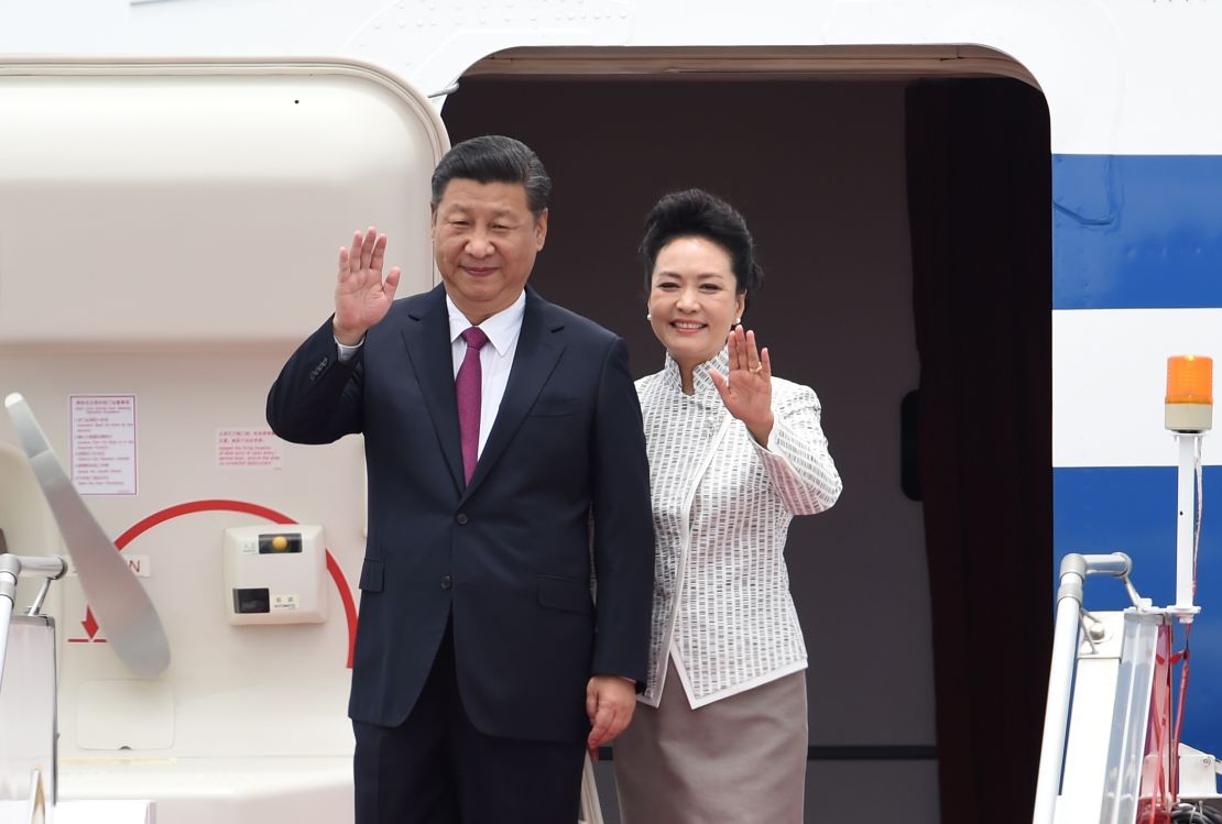 China's President Xi Jinping and his wife, Peng Liyuan, arrive in Hong Kong on June 29.
