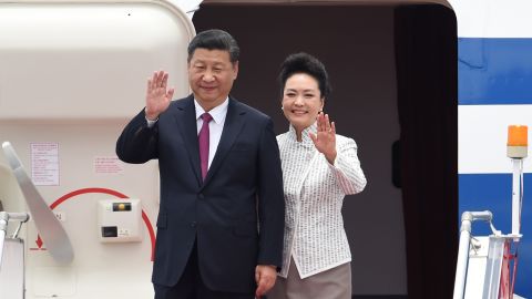 China's President Xi Jinping and his wife, Peng Liyuan, arrive in Hong Kong on June 29.