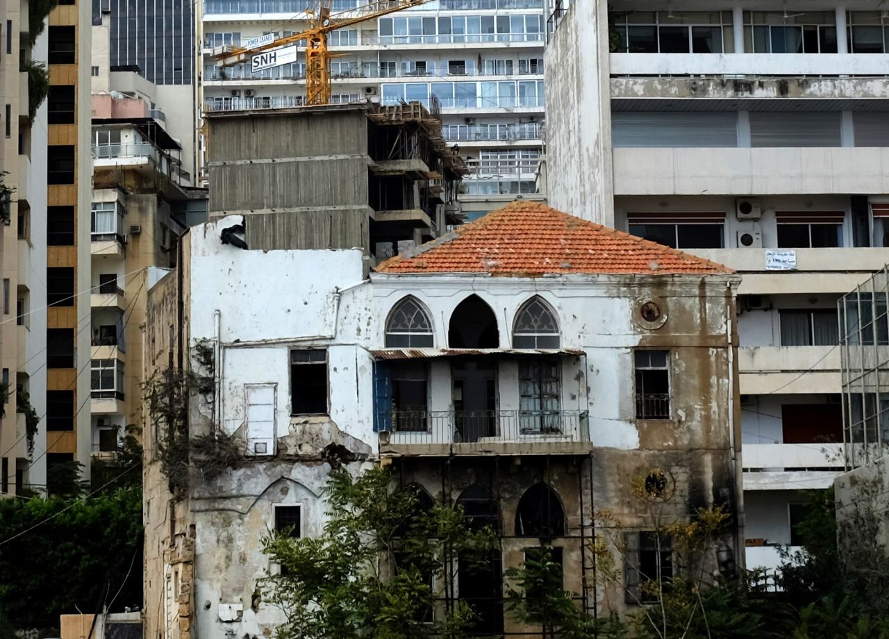 An old Lebanese house stands among modern buildings and a construction site on Beirut's Corniche on October 7, 2015. 