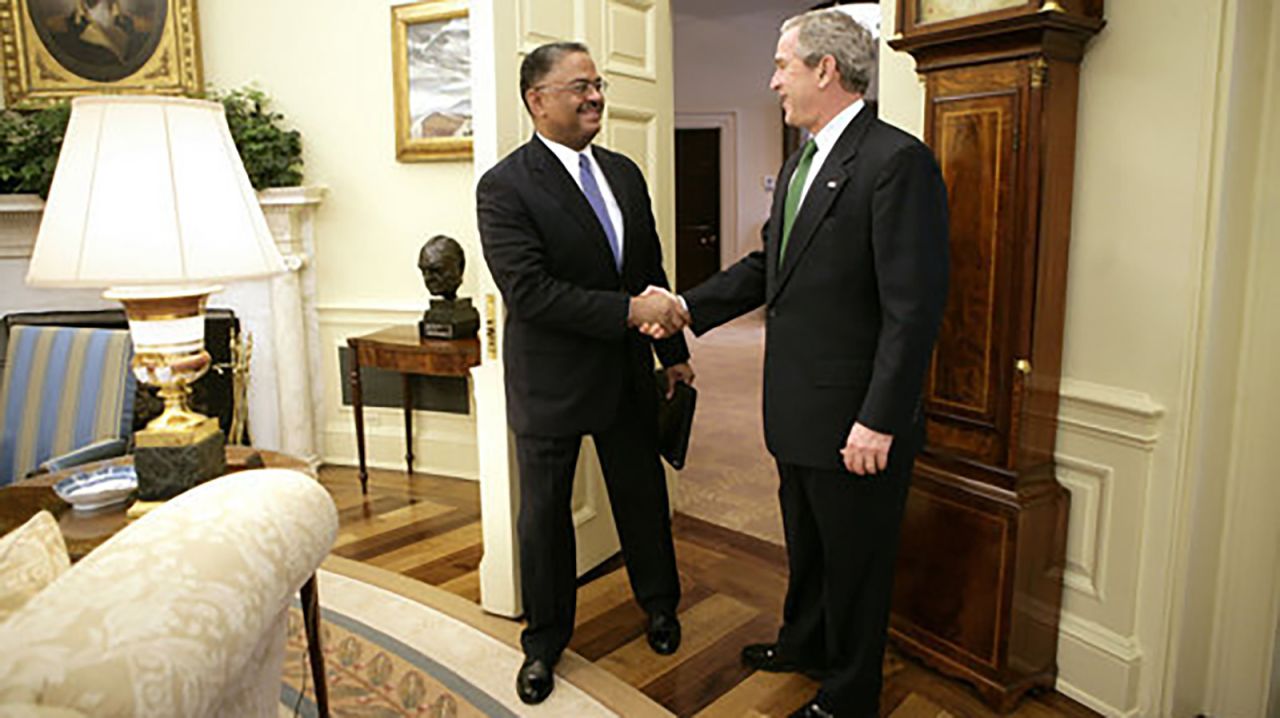 President George W. Bush welcomes U.S. Coast Guard Rear Adm. Stephen W. Rochon to the Oval Office Tuesday, February 20, 2007.  The New Orleans native was announced on that day as director of the executive residence and chief usher.  He was the eighth chief usher of the White House, and the first African-Amerikcan to hold that position.