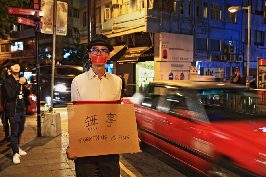 At the end of 2015, five Hong Kong booksellers, who published gossipy books about China's elite, went missing.  It was later discovered that the booksellers had been detained by Chinese authorities.  "Everything Is Fine" is Kacey Wong's response to the incidents. The artist taped his mouth shut and tied himself to a lamp post on a busy street in Hong Kong's art district. He then held up a cardboard sign saying "Everything Is Fine" in English and Chinese. "I'm an activist artist," Wong says. "That means I can accurately and honestly express my emotions, no matter how obscure those emotions are. When the public sees the work, it's almost like seeing a stone out of their mind -- it's like somebody is finally speaking honestly for them on their behalf."