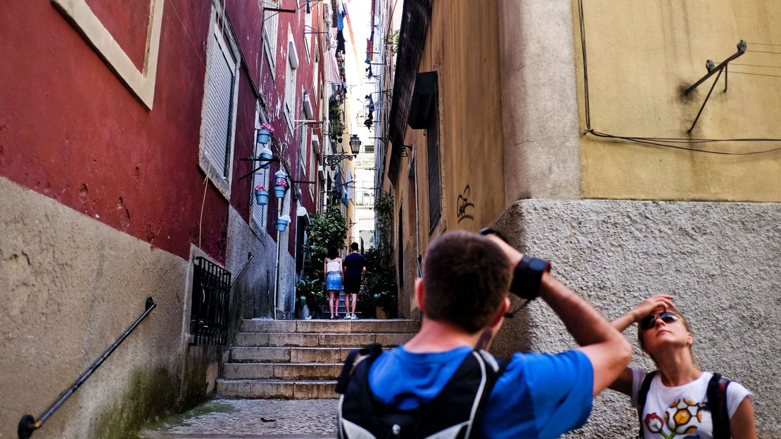 Lisbon's old quarter Alfama has a lighter pastel-colored outlook comparing to Porto's Ribeira area.