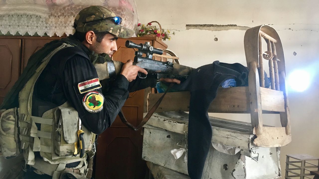 An Iraqi sniper scans for targets.