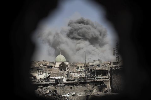 A bomb explodes near the al-Nuri mosque complex on Thursday, June 29. Iraq's military has seized the remains of the Great Mosque of al-Nuri. Iraq and the United States have accused ISIS of blowing up the historic mosque. 