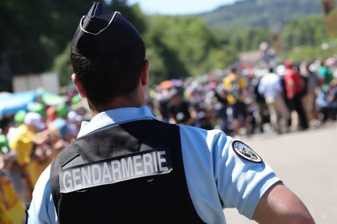 However, France remains in a state of emergency and on high alert to a possible terror attack. A French gendarme is pictured standing guard at the departure line prior to the start of the 209km sixteenth stage of the 103rd edition of the Tour de France cycling race on July 18, 2016 between Moirans-en-Montagne and Berne.